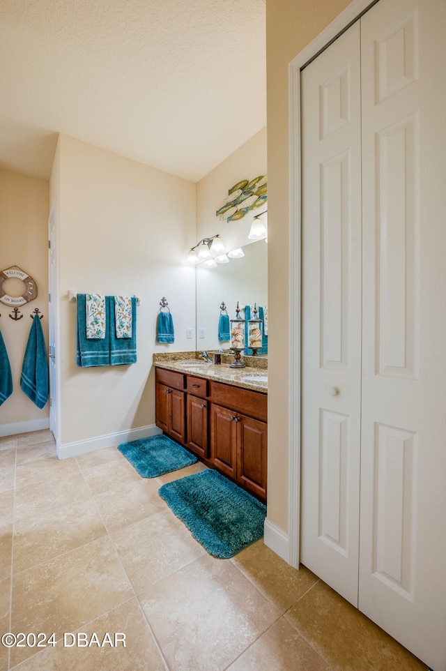 bathroom with vanity and tile patterned floors