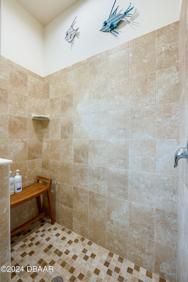 bathroom with a tile shower