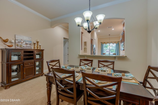 carpeted dining space with ornamental molding and a chandelier