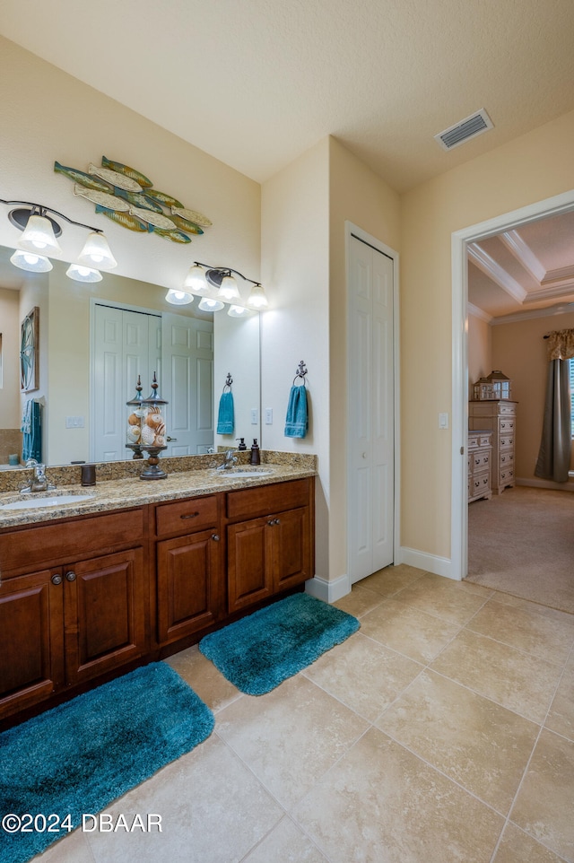 bathroom featuring vanity, a textured ceiling, and tile patterned floors