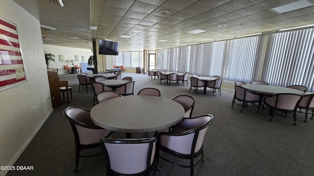 dining area with baseboards and carpet floors