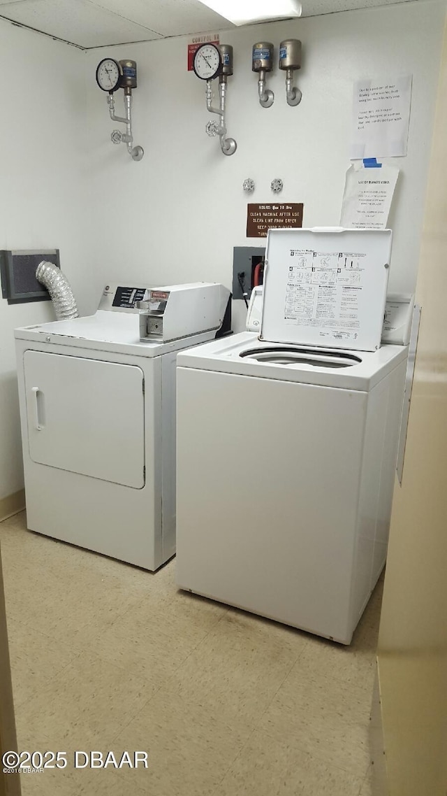 clothes washing area with independent washer and dryer