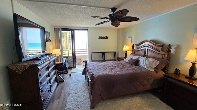 bedroom featuring a textured ceiling and ceiling fan
