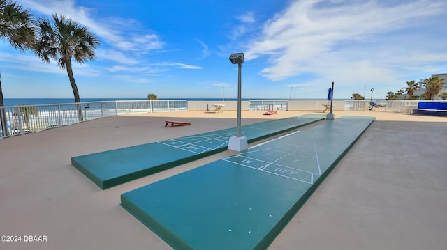 2625 S Atlantic Ave Unit 25Nw, Daytona Beach Shores, FL 32118 - view of home's community with shuffleboard, fence, and a water view