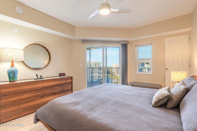 5300 S Atlantic Ave Unit 1-603, New Smyrna Beach, FL 32169 - bedroom with access to exterior, wood finished floors, and a ceiling fan