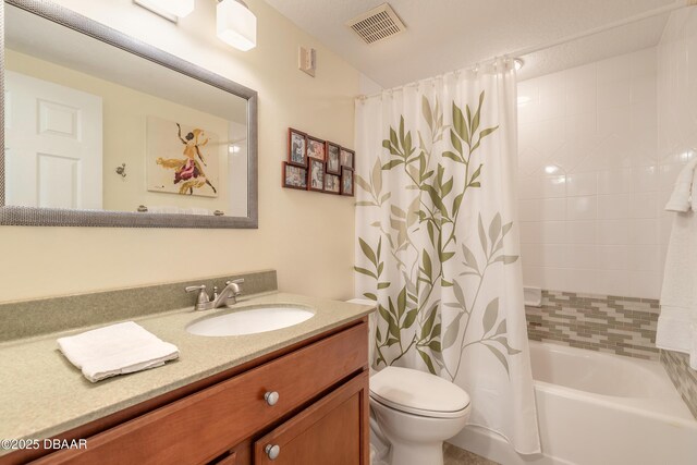 5300 S Atlantic Ave Unit 1-603, New Smyrna Beach, FL 32169 - bathroom featuring vanity, toilet, and shower / bath combo with shower curtain