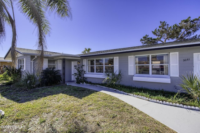 ranch-style home featuring a front yard