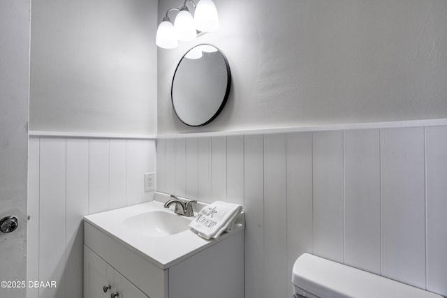 bathroom with toilet and vanity