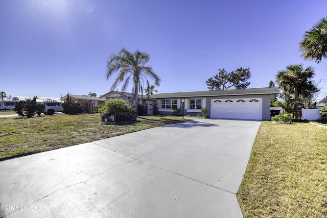 single story home with a garage and a front lawn