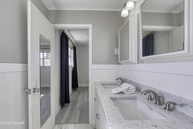 bathroom featuring vanity and ornamental molding