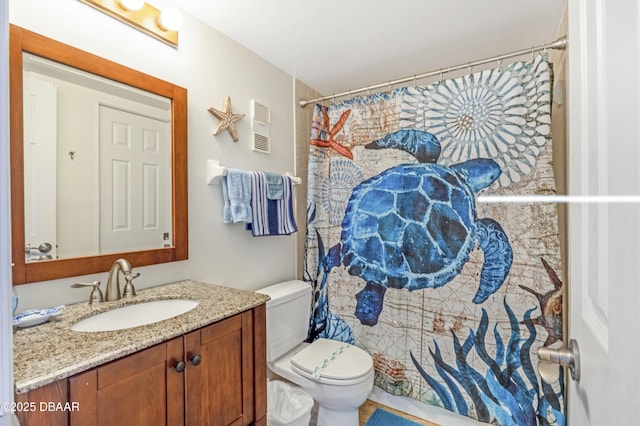 4453 S Atlantic Ave Unit 502, Port Orange, FL 32127 - bathroom with toilet, visible vents, curtained shower, and vanity