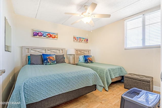 4453 S Atlantic Ave Unit 502, Port Orange, FL 32127 - bedroom featuring a ceiling fan and wood finished floors