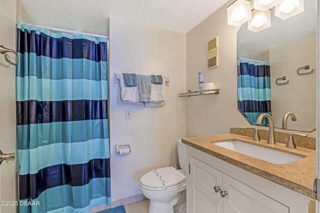 4453 S Atlantic Ave Unit 502, Port Orange, FL 32127 - full bathroom featuring visible vents, vanity, tile patterned floors, toilet, and a shower with shower curtain