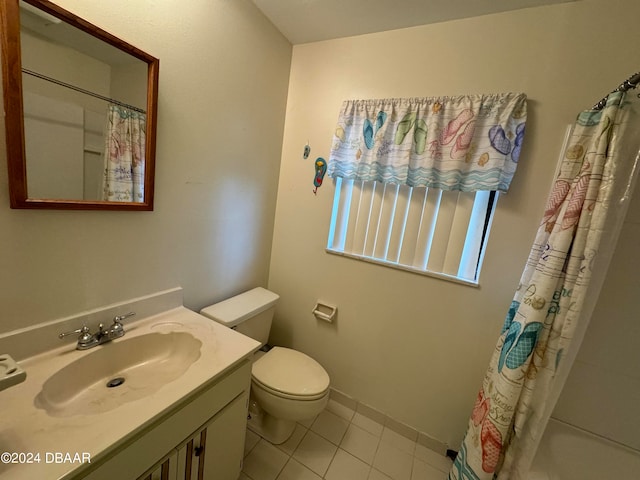 full bathroom with toilet, shower / tub combo, vanity, and tile patterned floors