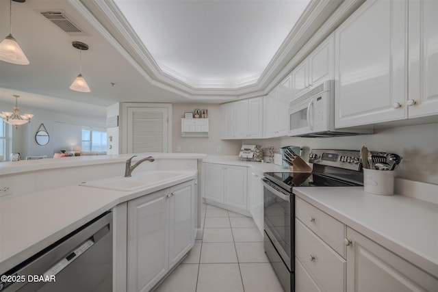 kitchen featuring white cabinetry, appliances with stainless steel finishes, sink, and ornamental molding