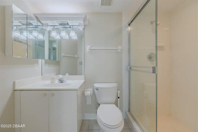 bathroom with vanity, an enclosed shower, and toilet