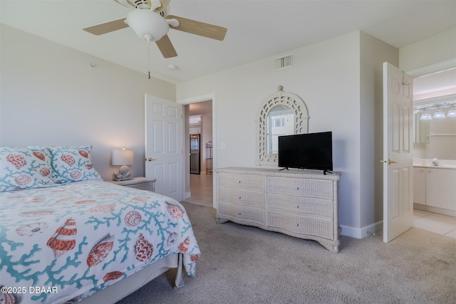 carpeted bedroom featuring sink and ceiling fan