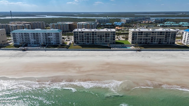 aerial view featuring a water view and a view of the beach