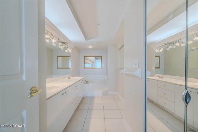 bathroom featuring vanity, a bath, and tile patterned flooring