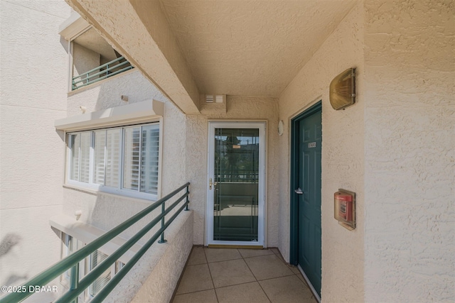 entrance to property with a balcony