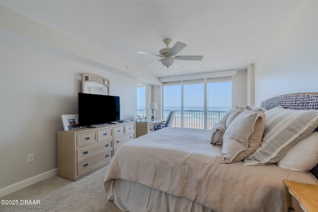 carpeted bedroom featuring access to exterior and ceiling fan