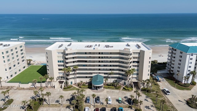 aerial view featuring a water view and a beach view