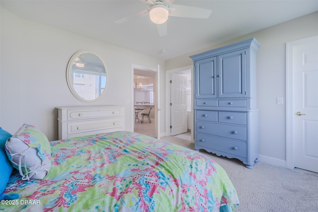 bedroom featuring ceiling fan and light colored carpet