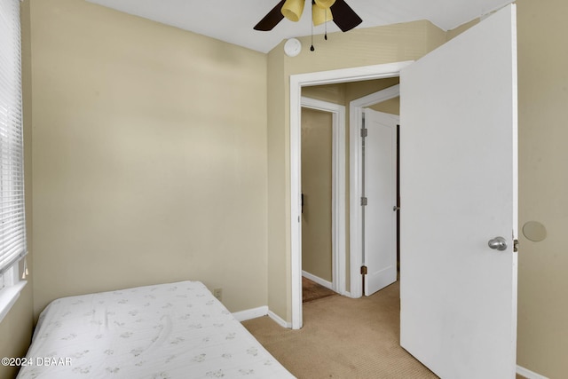 carpeted bedroom featuring ceiling fan