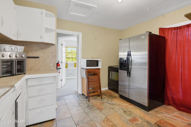 kitchen with decorative backsplash, white cabinetry, electric range, and stainless steel refrigerator with ice dispenser