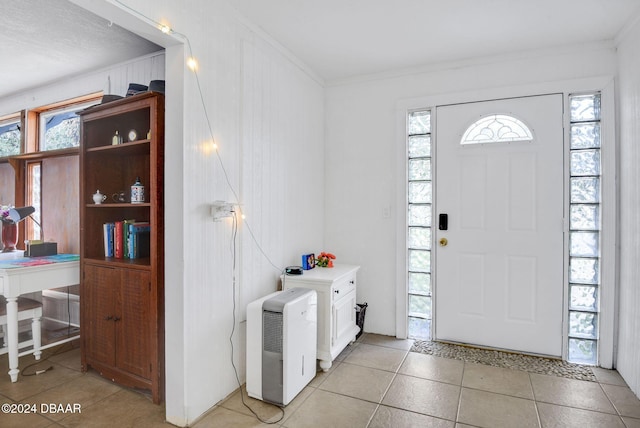 tiled entryway with crown molding