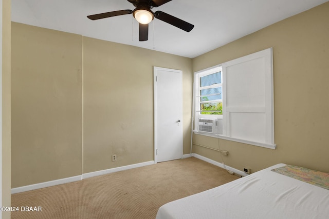 bedroom featuring ceiling fan, cooling unit, and light carpet