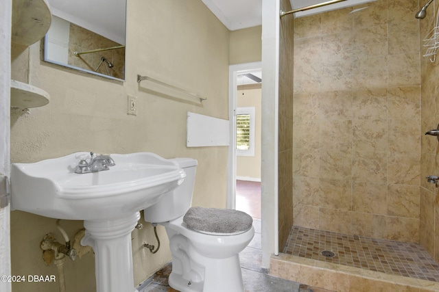 bathroom with toilet and tiled shower