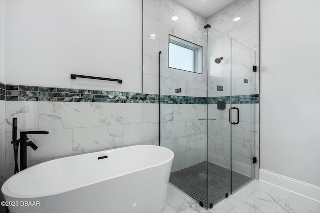 142 Sandpiper Ridge Dr, Ormond Beach, FL 32176 - full bathroom with a soaking tub, marble look tile flooring, a shower stall, and tile walls