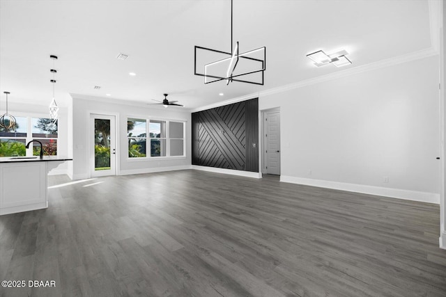 142 Sandpiper Ridge Dr, Ormond Beach, FL 32176 - unfurnished living room with baseboards, crown molding, plenty of natural light, and recessed lighting