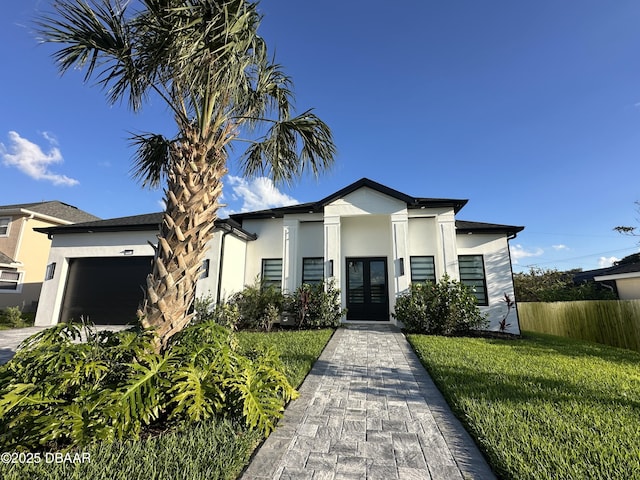 142 Sandpiper Ridge Dr, Ormond Beach, FL 32176 - contemporary home with french doors, stucco siding, and a garage