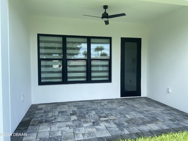 142 Sandpiper Ridge Dr, Ormond Beach, FL 32176 - doorway to property featuring stucco siding and ceiling fan