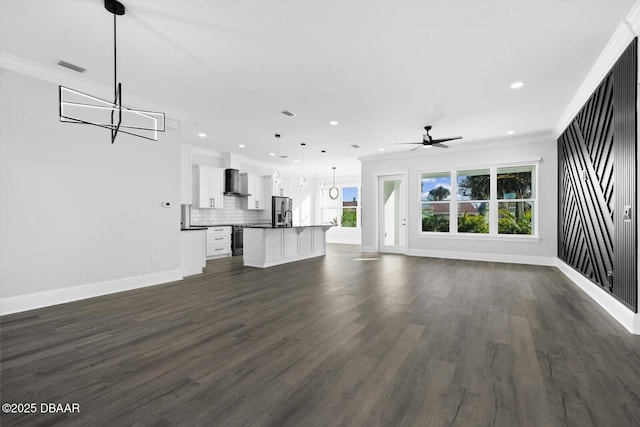 142 Sandpiper Ridge Dr, Ormond Beach, FL 32176 - unfurnished living room featuring a ceiling fan, crown molding, a chandelier, baseboards, and recessed lighting