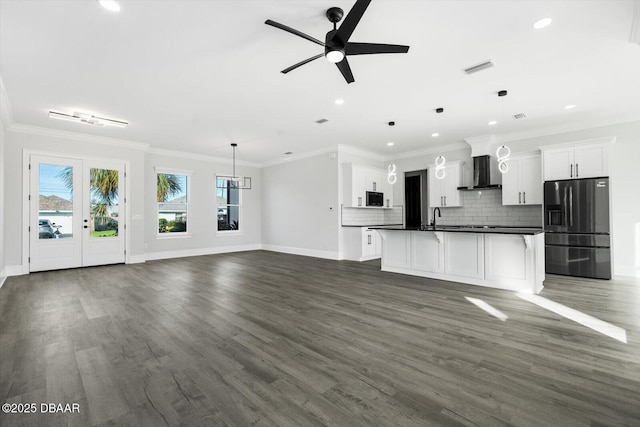 142 Sandpiper Ridge Dr, Ormond Beach, FL 32176 - unfurnished living room featuring ceiling fan, baseboards, recessed lighting, ornamental molding, and dark wood-style floors