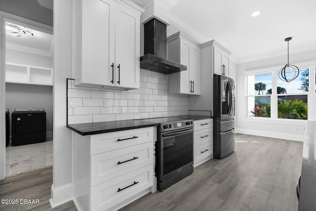 142 Sandpiper Ridge Dr, Ormond Beach, FL 32176 - kitchen featuring washer / clothes dryer, stainless steel appliances, wall chimney range hood, ornamental molding, and dark countertops