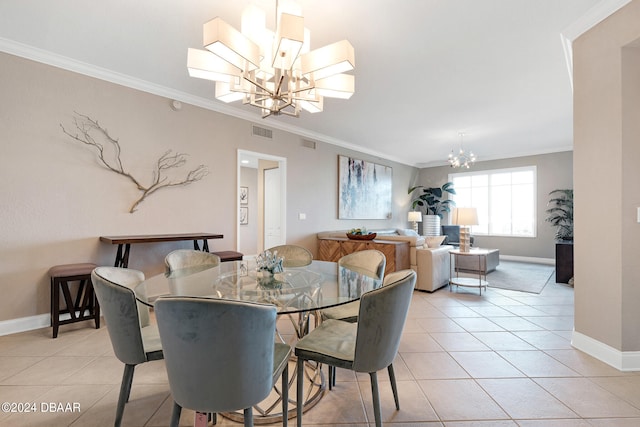 dining room with a chandelier, light tile patterned floors, and ornamental molding