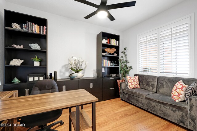 home office featuring light wood-type flooring and ceiling fan