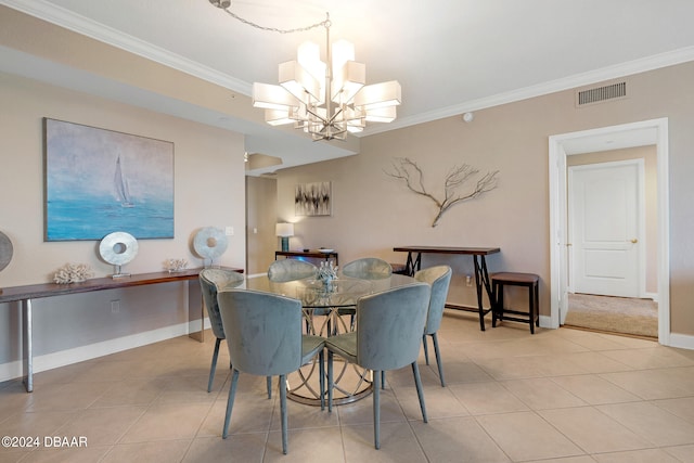 tiled dining space featuring a chandelier and crown molding