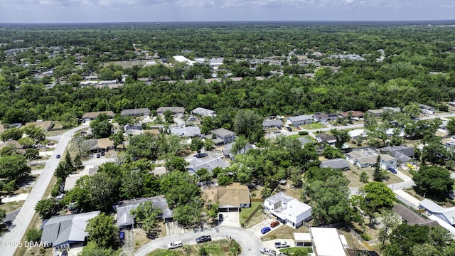 aerial view featuring a view of trees and a residential view