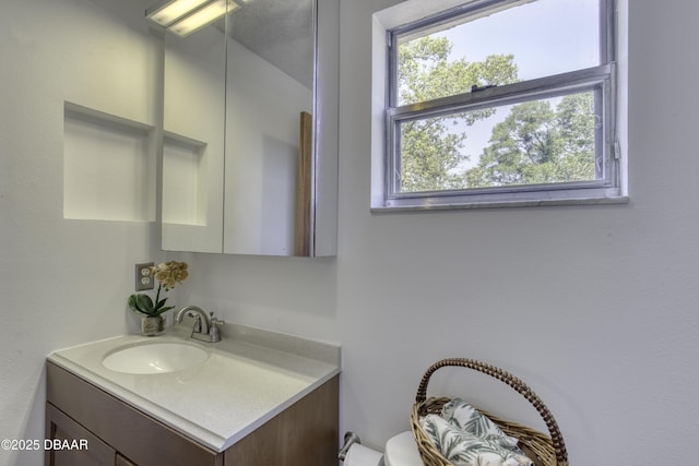 half bath with vanity and toilet