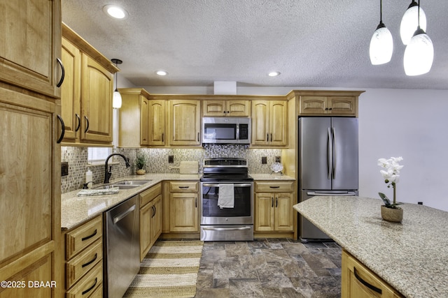 kitchen featuring backsplash, appliances with stainless steel finishes, pendant lighting, and light stone counters