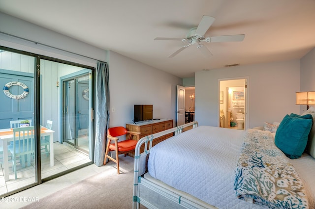 4405 Sea Mist Dr Unit 218, New Smyrna Beach, FL 32169 - bedroom featuring access to outside, a ceiling fan, ensuite bath, and light tile patterned floors