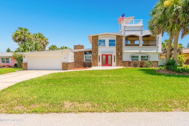 46 Oceanview Ave, Ponce Inlet, FL 32127 - view of front of house with french doors, stucco siding, stone siding, and a balcony