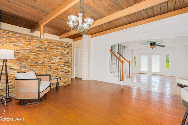 46 Oceanview Ave, Ponce Inlet, FL 32127 - unfurnished room with stairway, a wood ceiling with exposed beams, a chandelier, wood finished floors, and a ceiling fan