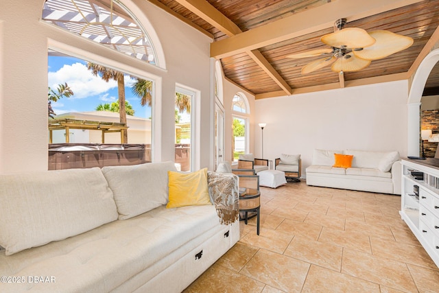 46 Oceanview Ave, Ponce Inlet, FL 32127 - living area with a wooden ceiling with exposed beams, a ceiling fan, and arched walkways