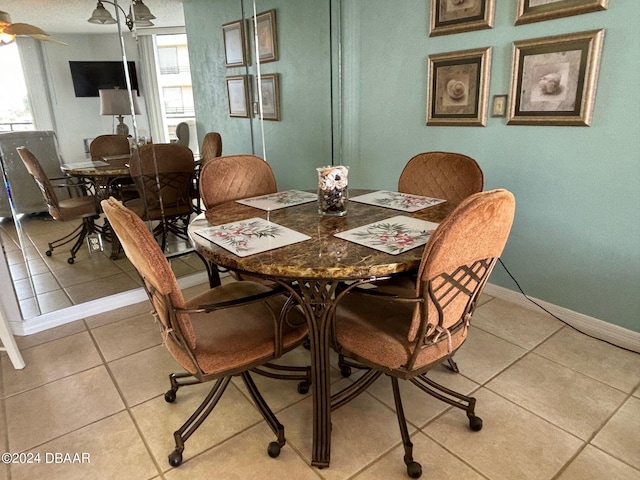 dining area with light tile patterned floors